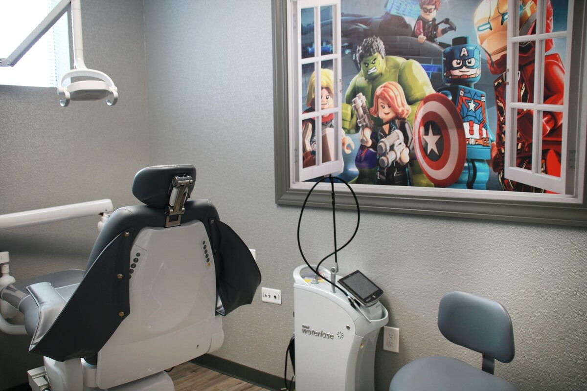 Young girl with dental examination taking place