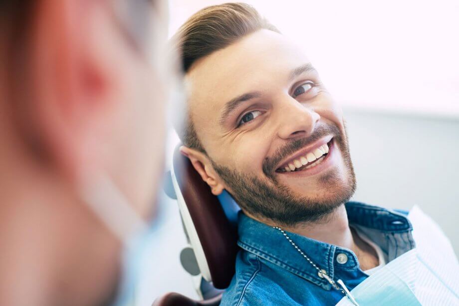 man smiling in dental chair