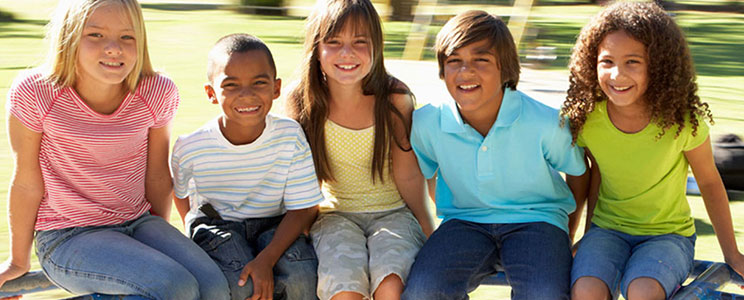 Group of smiling children sitting together